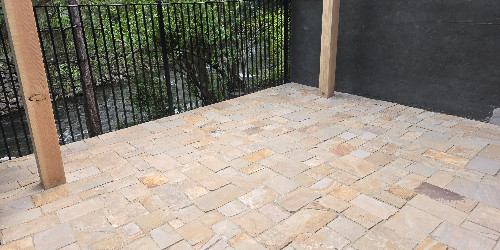 Patio with a water feature and pond
