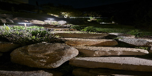 Patio with a rustic stone design
