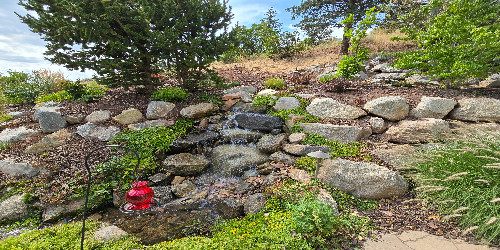 Natural rock waterfall feature